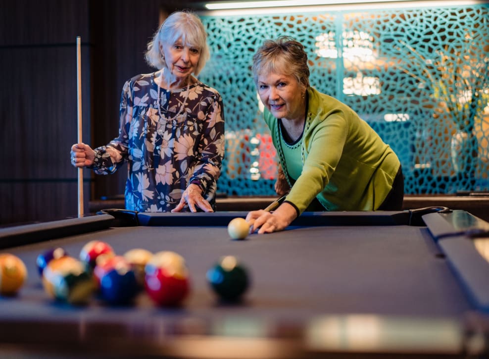 Residents having fun playing pool at Murano in Seattle, Washington