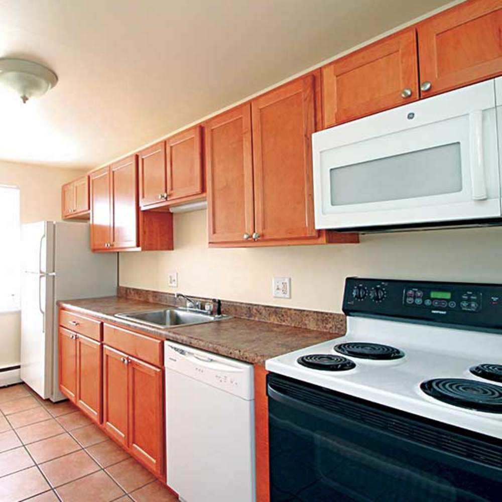 Kitchen showign appliances and a dishwasher at Highland Bay Apartments in Rochester, New York