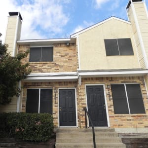 Exterior and front steps to the apartments at Highland Oaks in Duncanville, Texas