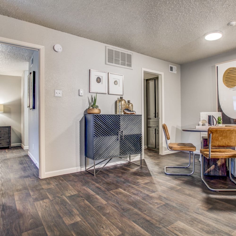 Living space with wood-style flooring and a couch and coffee table at The Reese at Eastchase in Fort Worth, Texas