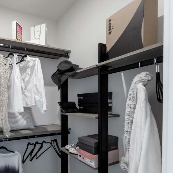 Closet with hanging racks and shelving at Continuum Apartments in Las Vegas, Nevada