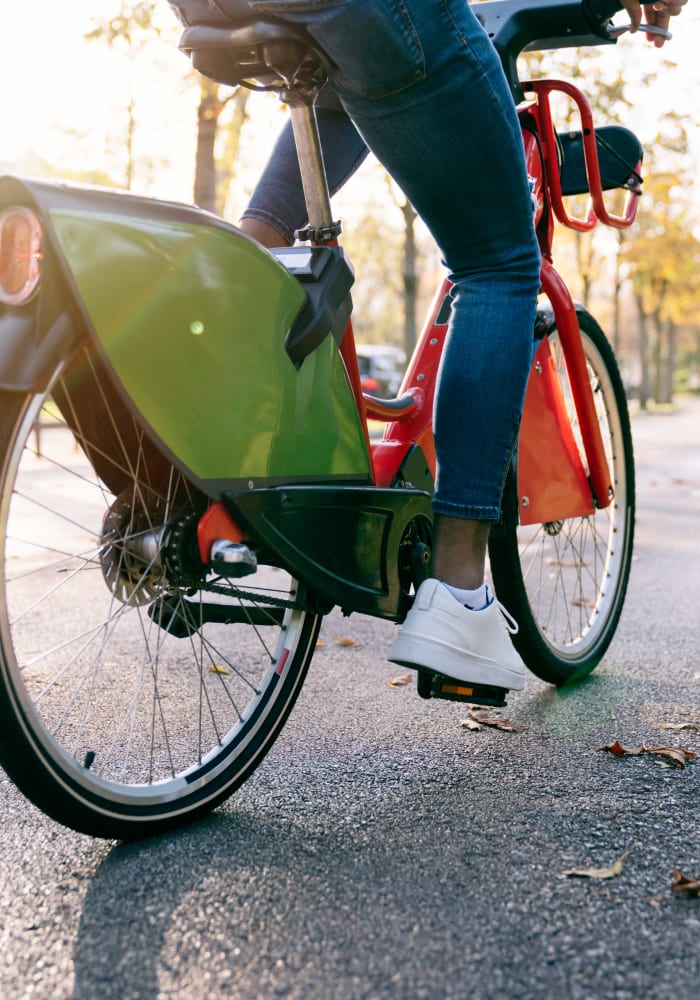 A resident riding their bike through a park near Arbor Gates in Fairhope, Alabama