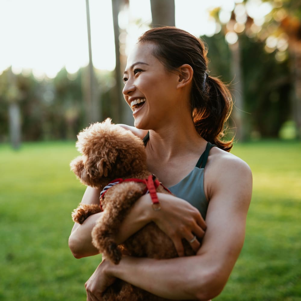 Person with dog at The Everstead at Windrose in Spring, Texas