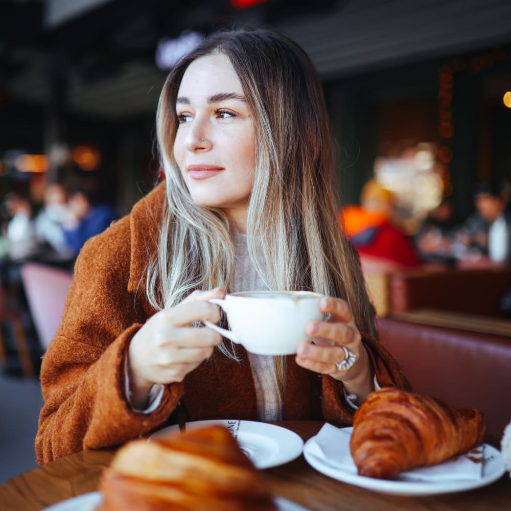 Resident enjoying a coffee near Theatre Lofts in Birmingham, Alabama