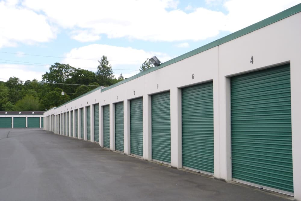 Storage units with green doors at America's Self Storage in Vancouver, Washington
