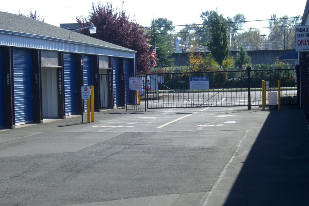 Wide driveway between storage units and the secure gate at Stor-N-Lok in Eugene, Oregon