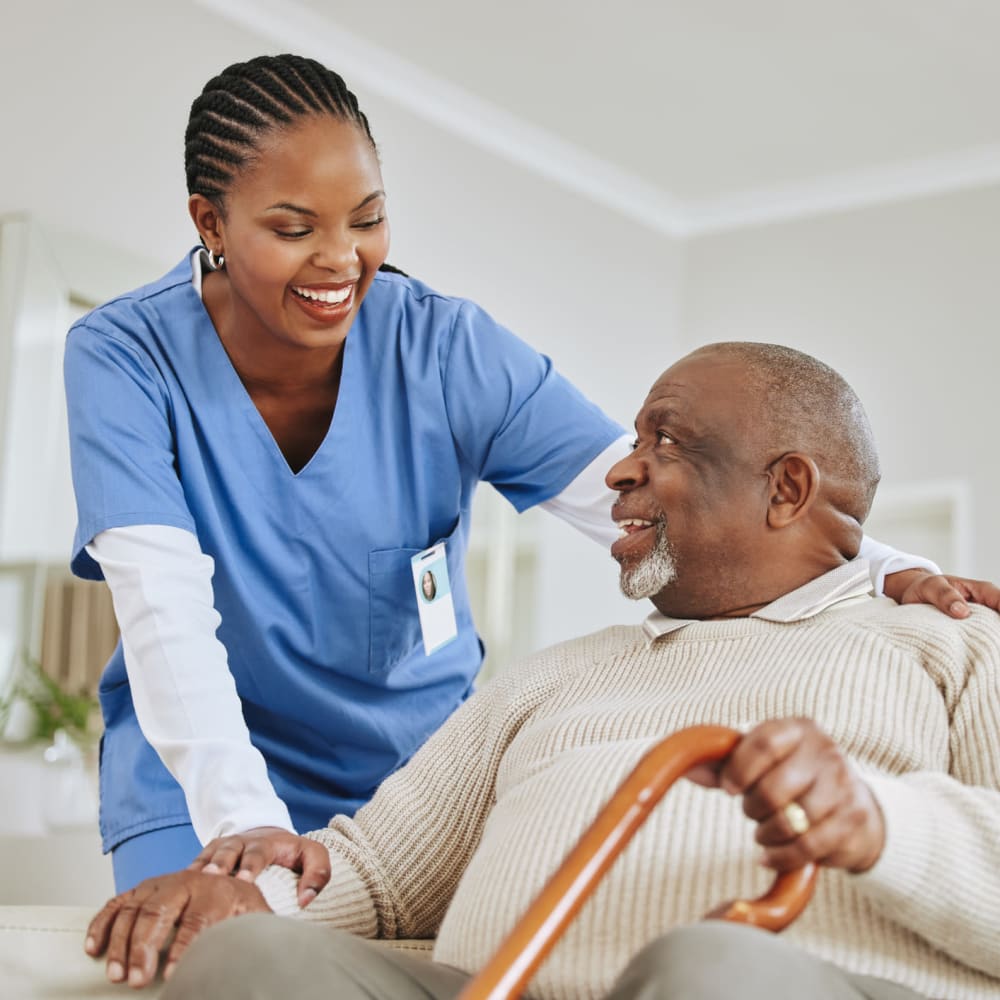 Resident being assisted by a caretaker at Regency Pacific Management in Bellevue, Washington