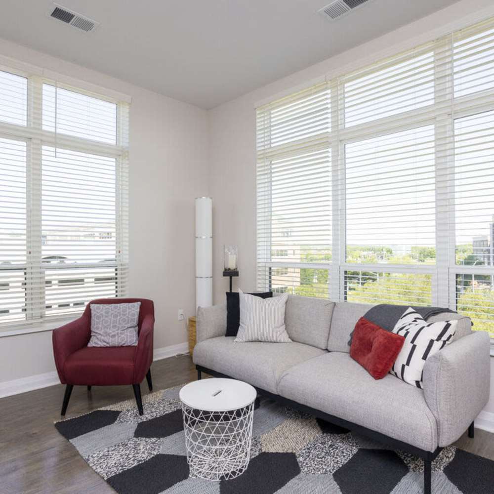 Spacious living room with large windows at The Sutton in , Ohio
