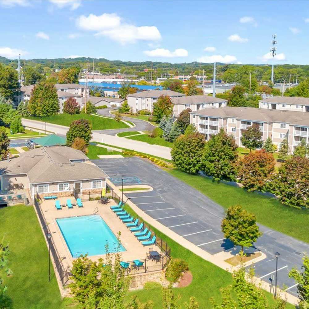Beautiful exterior view along with swimming pool at Timber View Apartments in Grand Haven, Michigan