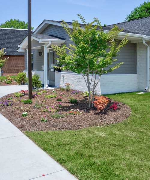 Lush green garden view at Bell Diamond Manor in Norfolk, Virginia
