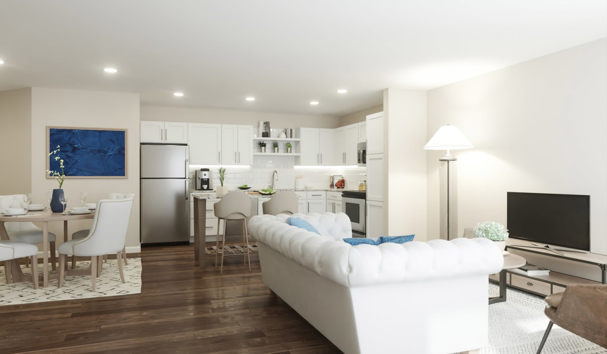 Model kitchen with stainless-steel appliances and wood finish cabinets at Attain at Towne Centre, Fredericksburg, Virginia