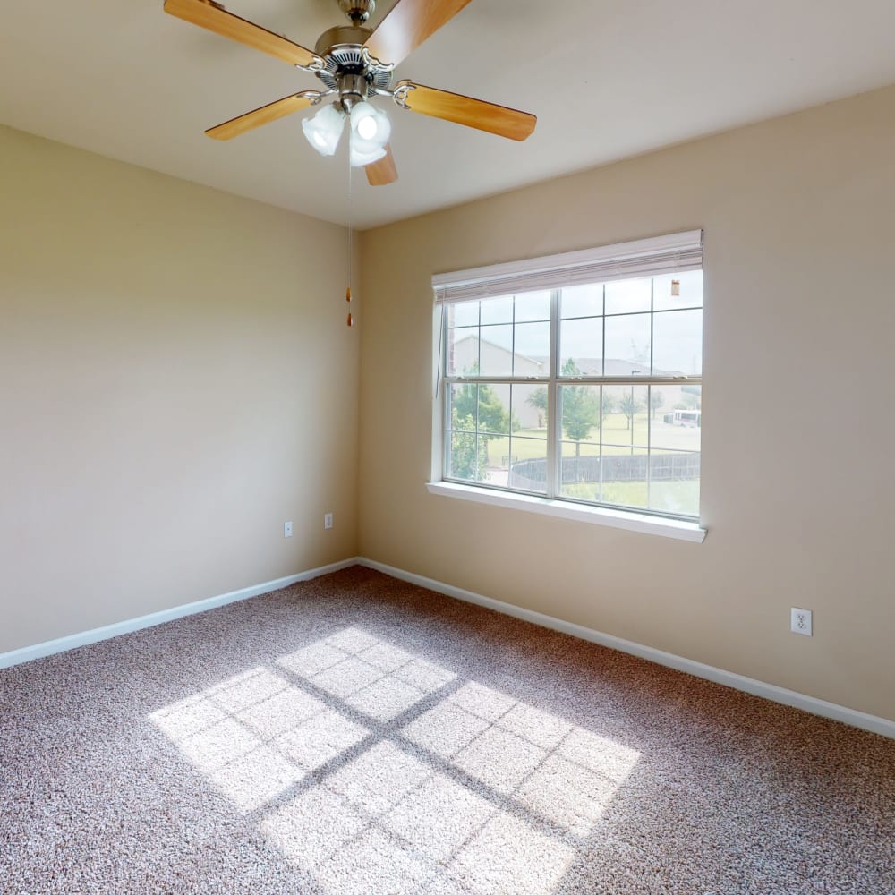 Upper floor of a townhome with plush carpeting throughout at Oaks Estates of Coppell in Coppell, Texas