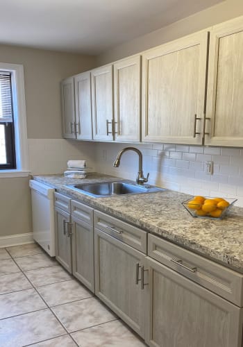 Elegant counter and cabinet space in kitchen at Englewood Village in Englewood, New Jersey