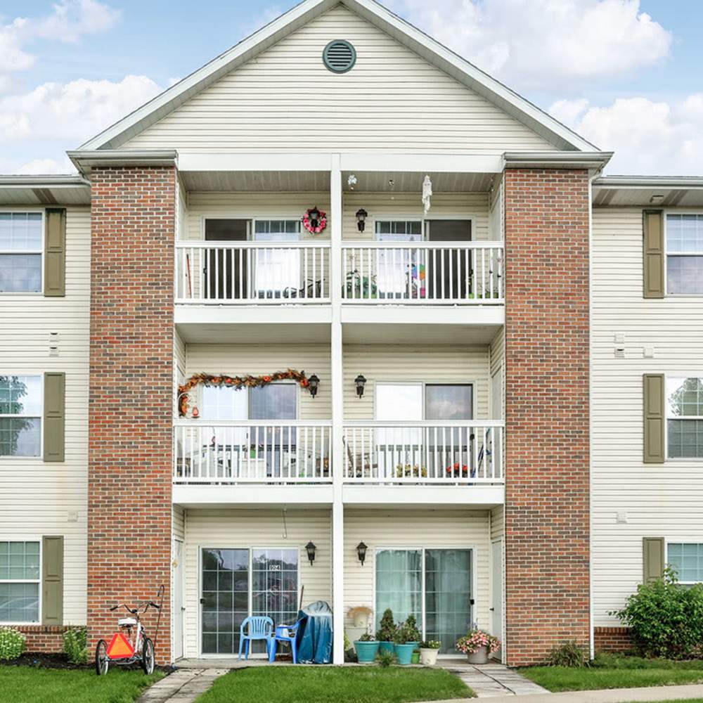 Balconies with chairs and plants at Laurelhurst in Clyde, Ohio