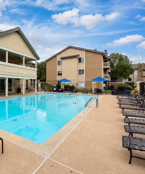 Large swimming pool with lounge chairs at Waterford Manors in Manchester, Missouri