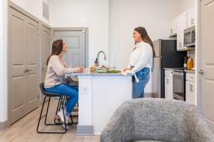 Kitchen with appliances at The Waters at Promenade in Marrero, Louisiana