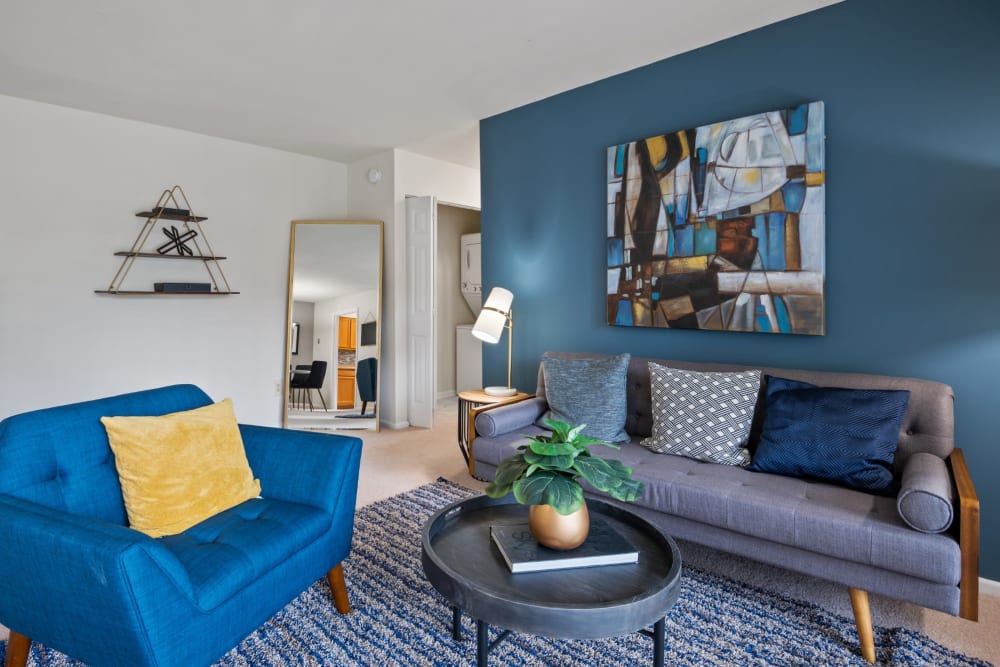 Living room with an accent wall at Mount Vernon Square Apartment Homes in Alexandria, Virginia