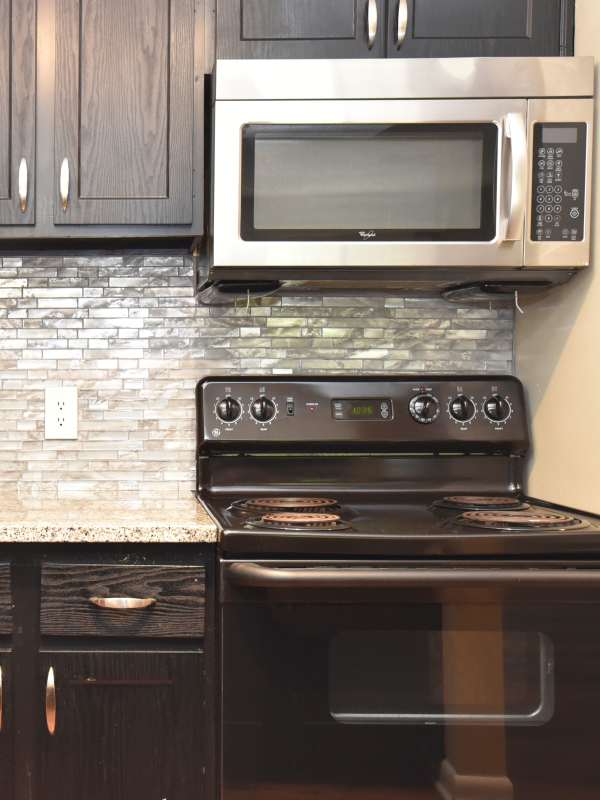 Apartment kitchen with stainless-steel appliances at The Metropolitan in Nashville, Tennessee