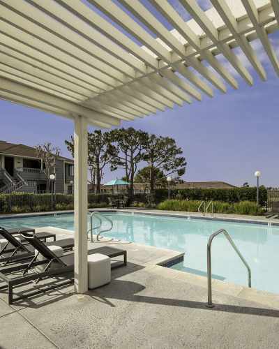 Swimming pool patio with pergola at Pacific Pointe Apartment Homes, San Clemente, California