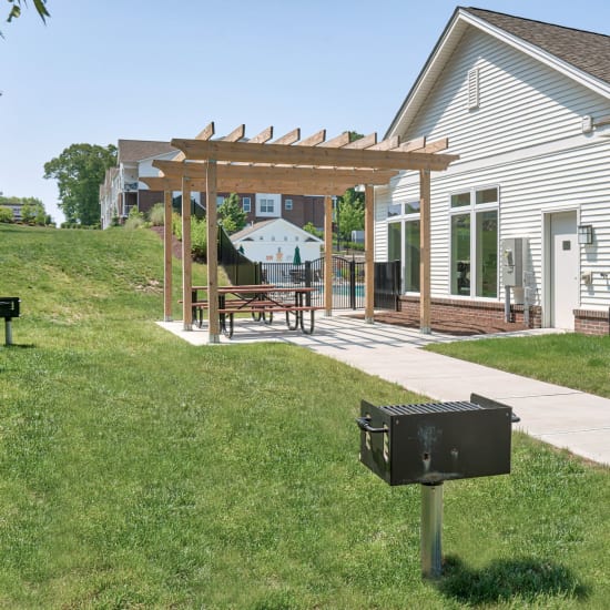 Picnic area with grilling stations at Pleasant Valley Apartments in Groton, Connecticut