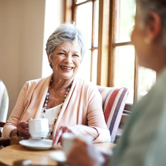 Friends drinking coffee at Grace Manor Assisted Living in Nashville, Tennessee