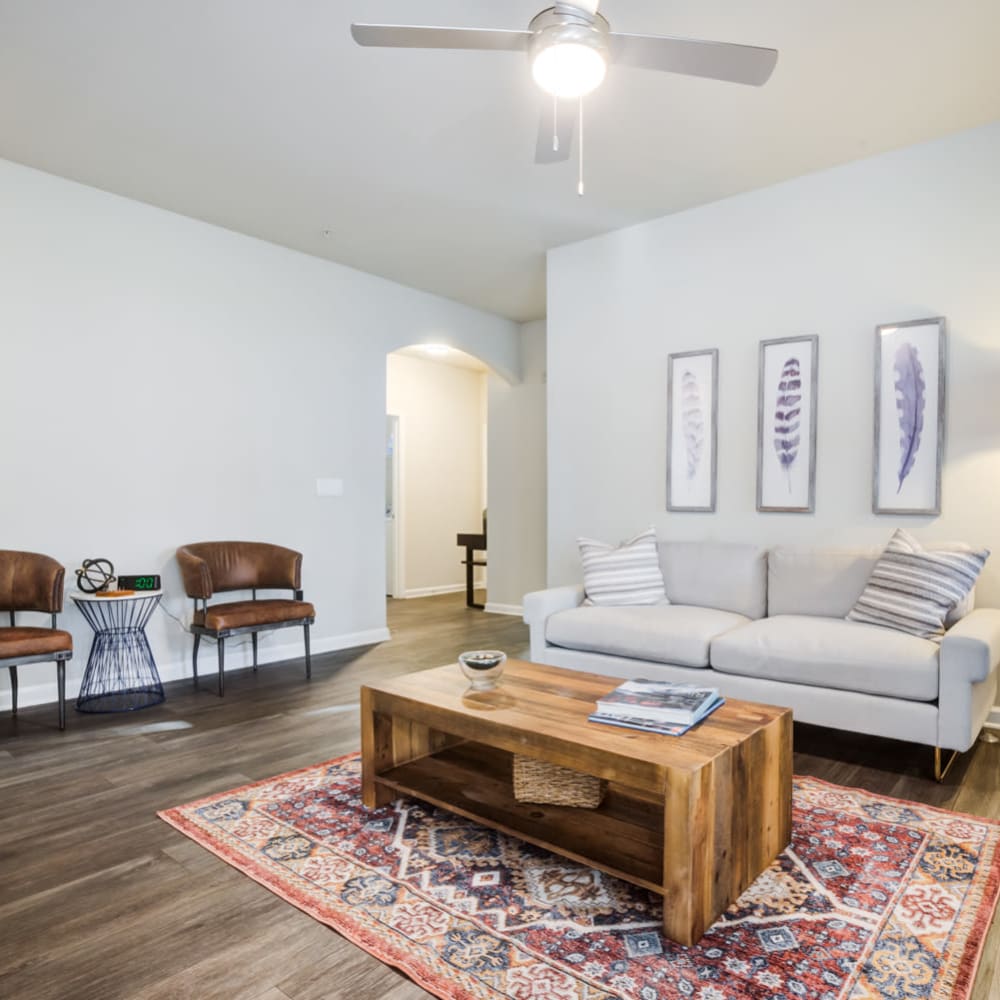 Living room with 2 chairs and a sofa at North Hills at Town Center in Raleigh, North Carolina