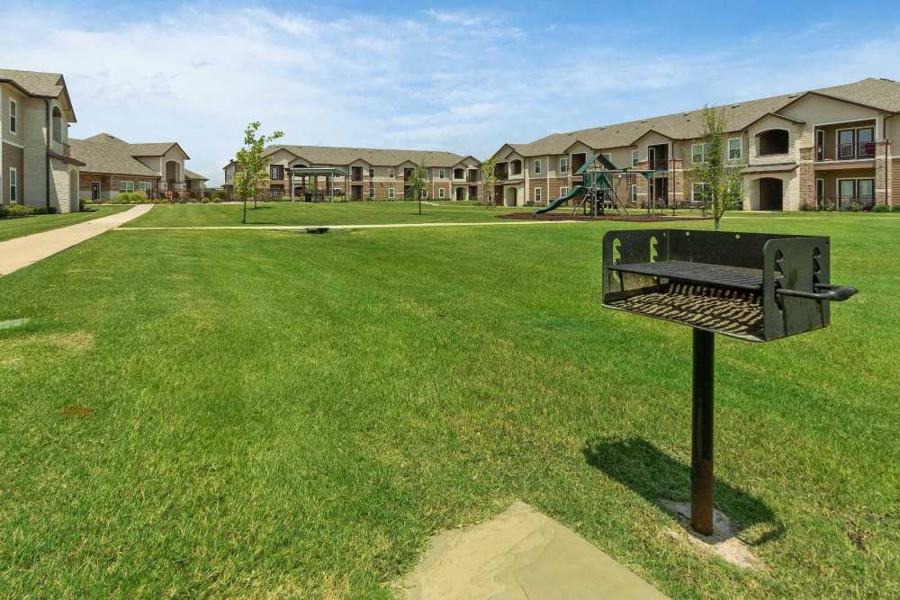 Fenced dog park and playground at Pine Creek in Paris, Texas