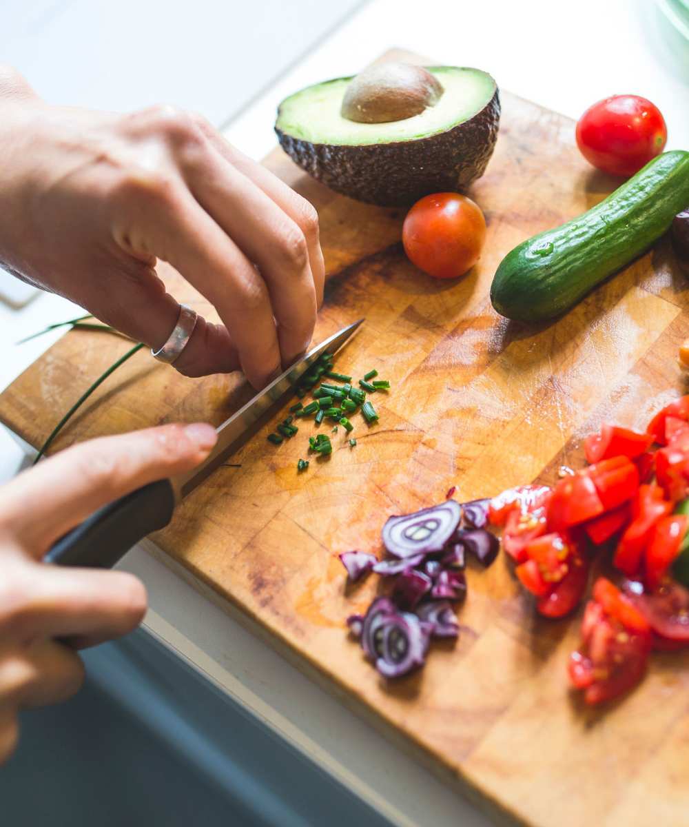 Someone cutting vegetables at Stonecrest Apartments in Spokane, Washington
