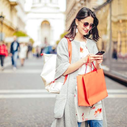 Resident carrying shopping bag and walking on the street near Avonlea Highlands in Cartersville, Georgia