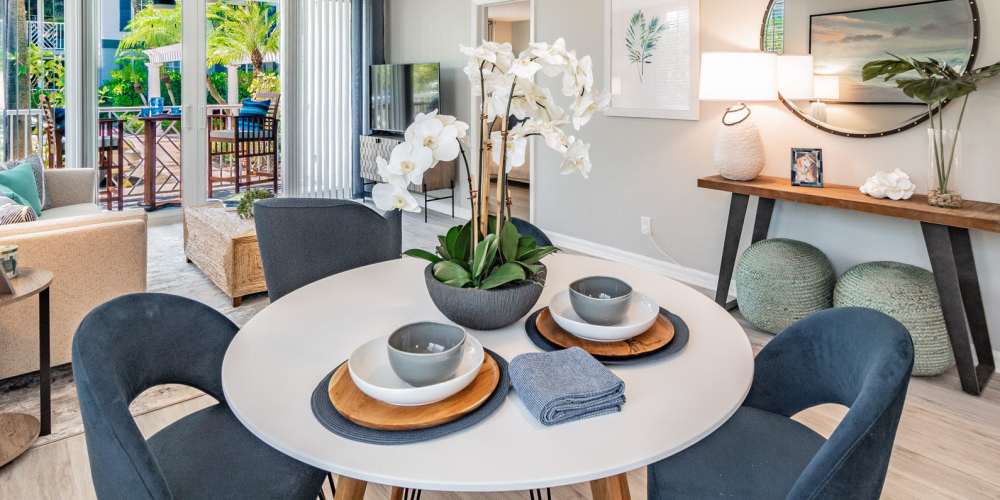 Beautiful kitchen table with fresh flowers at Bermuda Cay in Boynton Beach, Florida