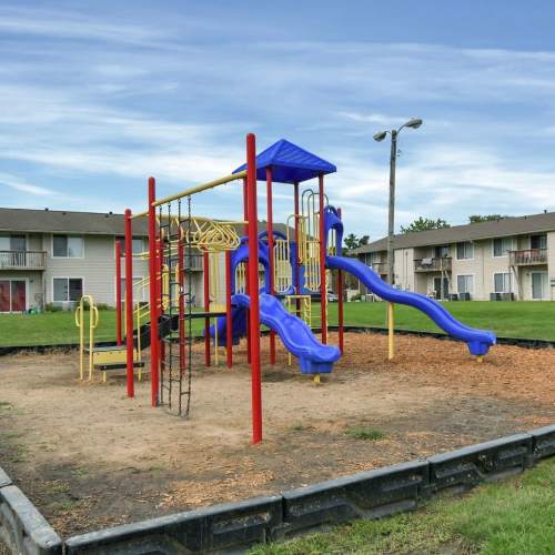 Clubhouse kitchen with bar stools and large windows at Greentree in Indianapolis, Indiana