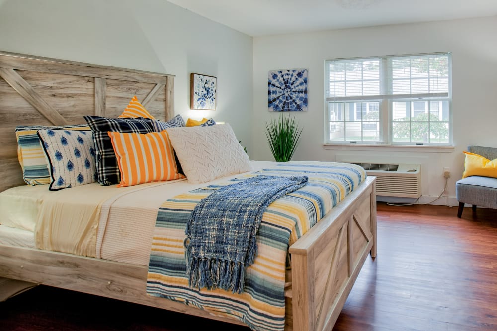 Room with one beds and a dresser in a large bedroom at Wood Haven in Tewksbury, Massachusetts