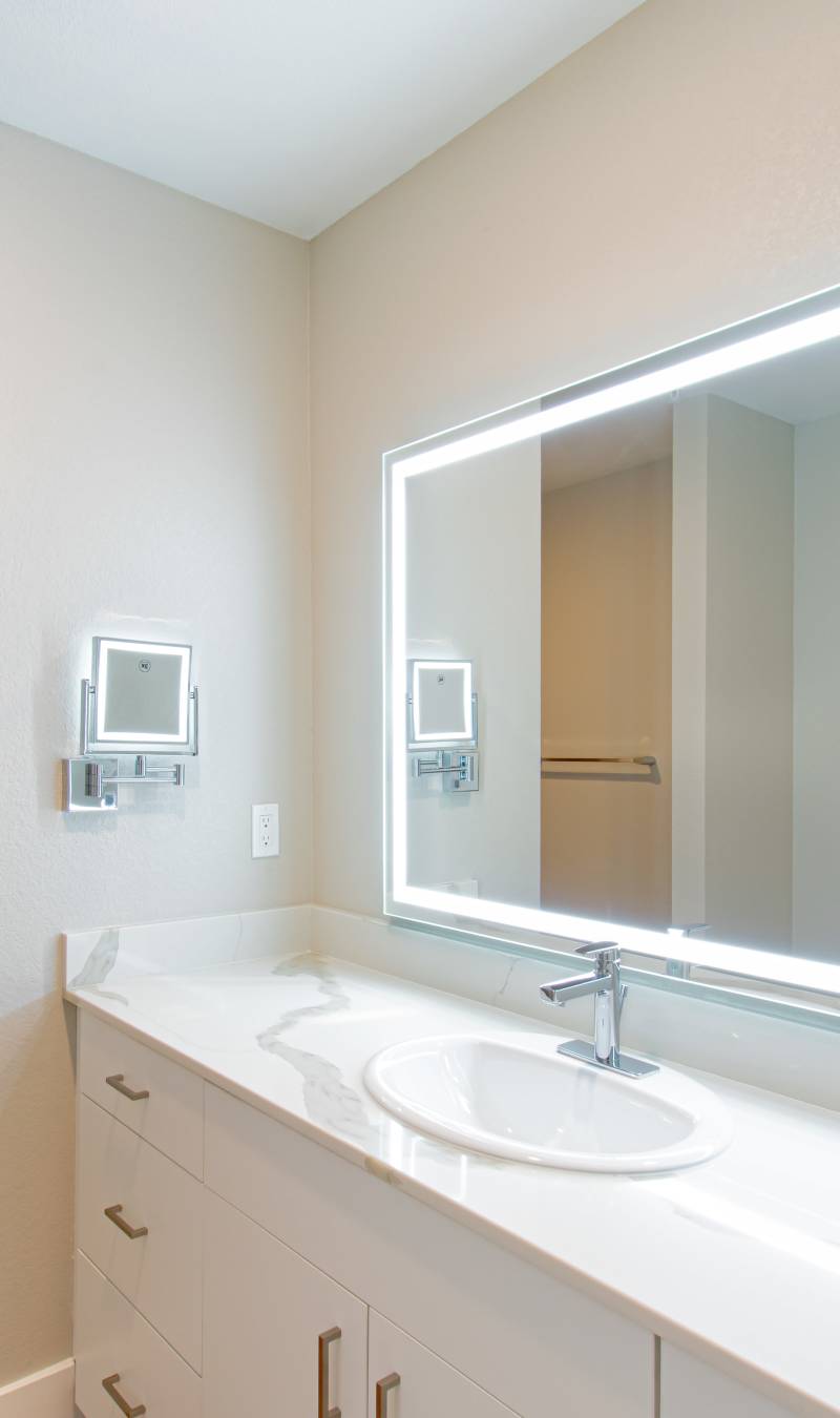 Living room with leather couch at Stone Village Apartments in Reno, Nevada