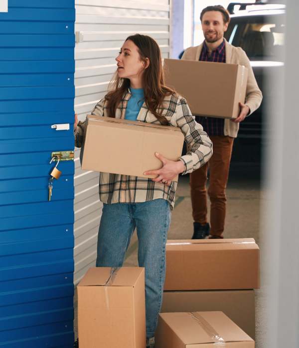 Customers packing and carrying boxes at Storage Hub - WW White Rd in San Antonio, Texas