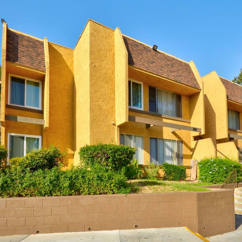 Charming apartments with surrounded by greenery at St. Andrews Gardens in Los Angeles, California