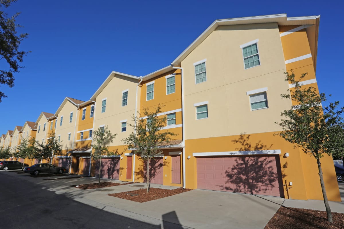 The yellow exterior of Town Park Villas in Tampa, Florida
