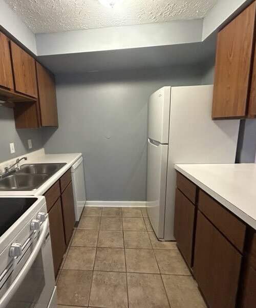 Kitchen with refrigerator at Brookside Commons in Meadville, Pennsylvania