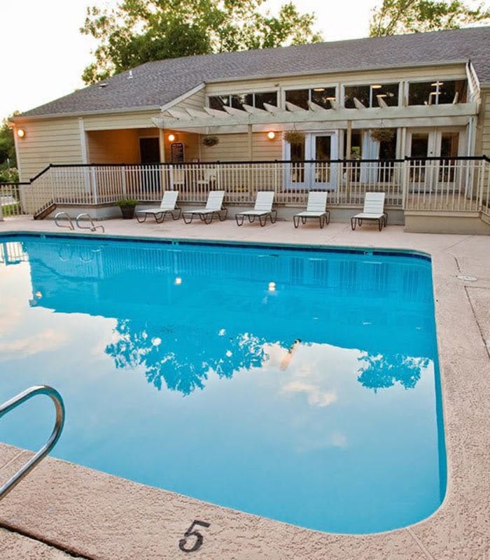 Sparkling pool and sundeck outside of Country Hollow in Tulsa, Oklahoma