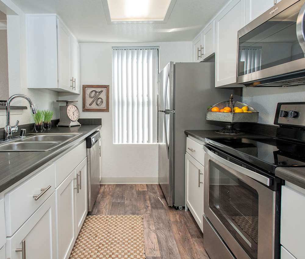 Kitchen with stainless-steel appliances at Sandpiper Village Apartment Homes in Vacaville,California