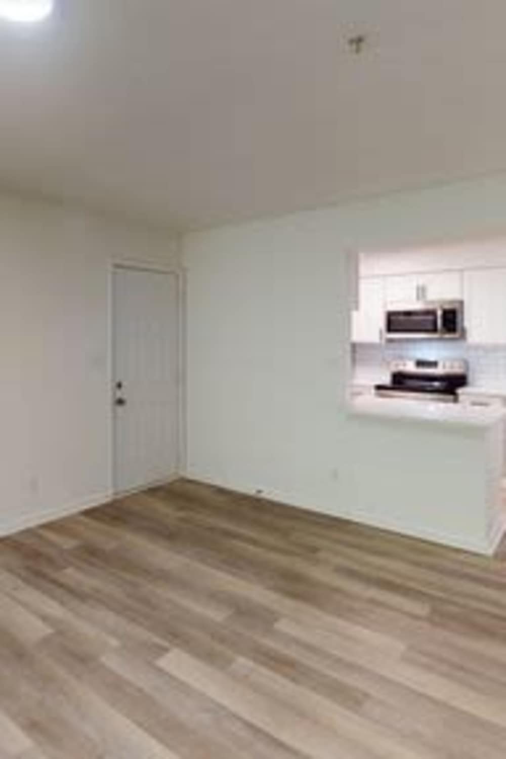 Living room with wooden flooring at Wallace Terrace Apartments in Charlotte, North Carolina 