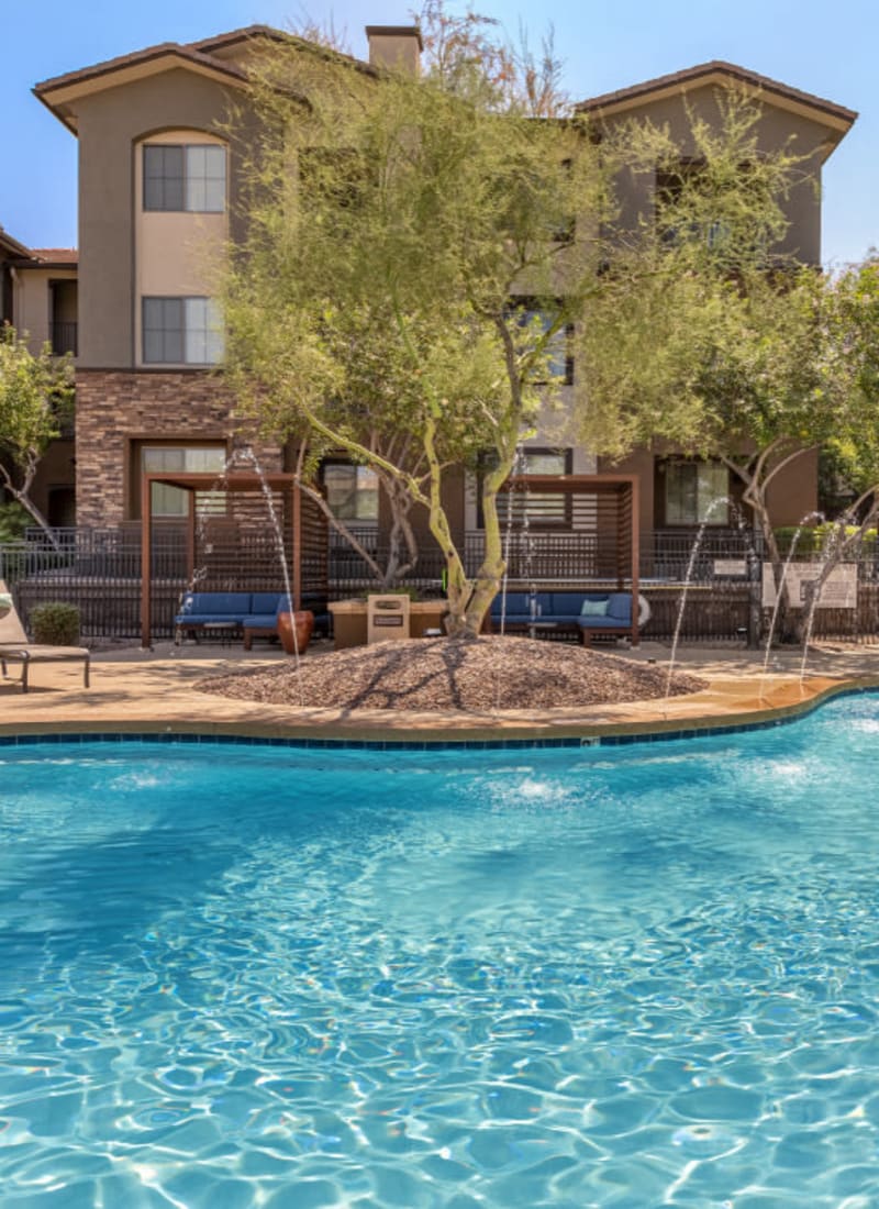 Sparkling resort style pool with water features at Marquis at Sonoran Preserve in Phoenix, Arizona