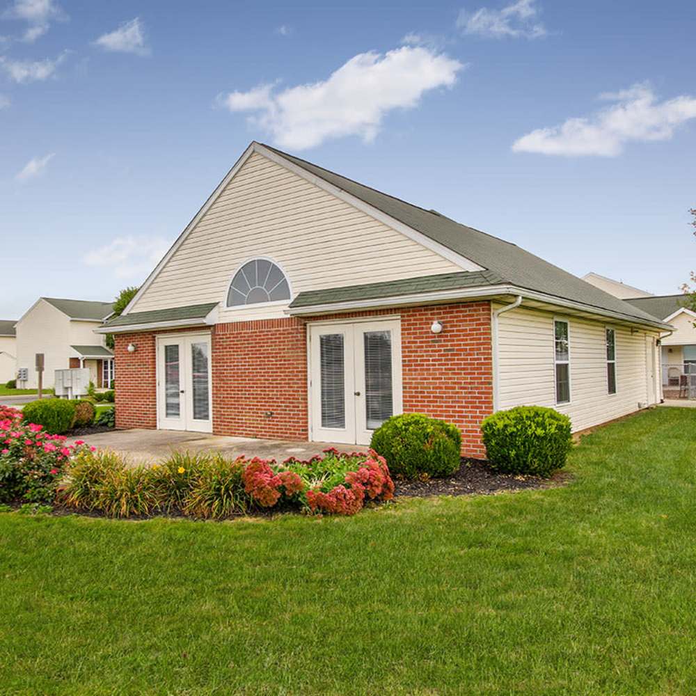 Brick exterior with landscaped garden at Wellington Place in Ottawa, Ohio