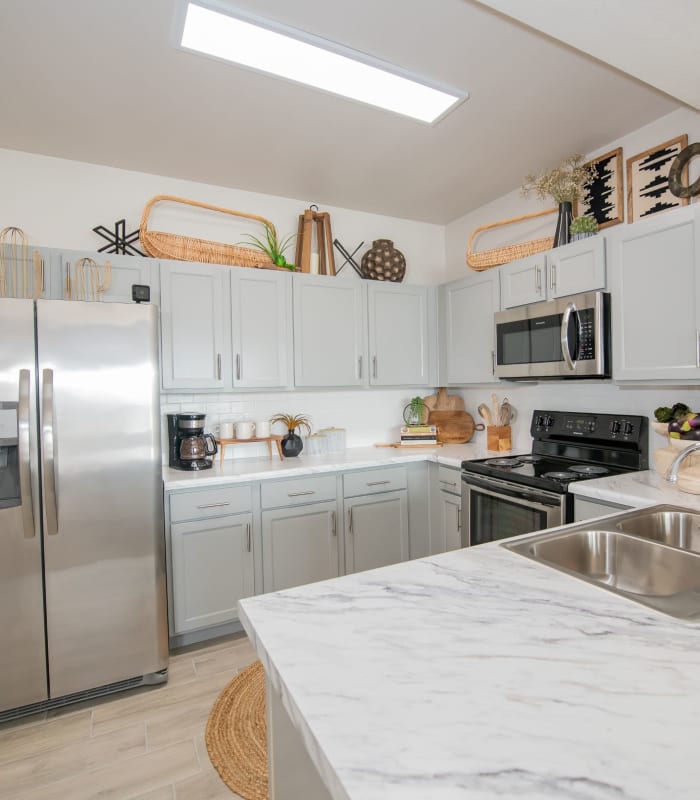 Kitchen with granite countertops at Center 301 Apartments in Belton, Missouri