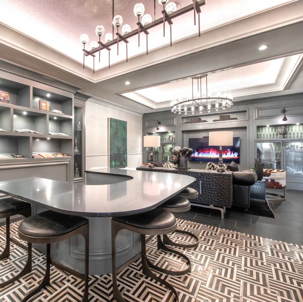 Modern lounge area with stylish bar seating at Novel Turtle Creek in Dallas, Texas