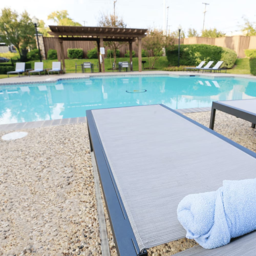 Swimming pool with lounge beds at Dominion Park in San Antonio, Texas
