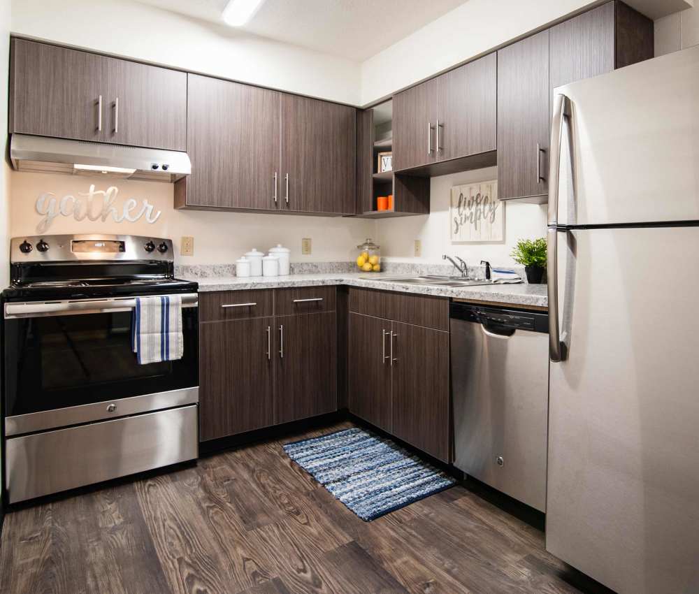 Modern kitchen with stainless steel appliances at South Meadow in Ames, Iowa