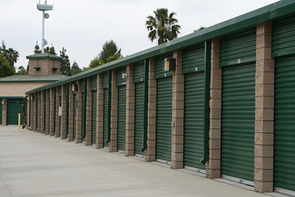 Green rollup doors at Our Self Storage. 