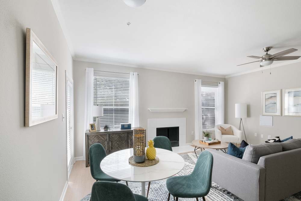 Furnished  model unit living room with fireplace and modern furnishings at Andover at Crabtree in Raleigh, North Carolina