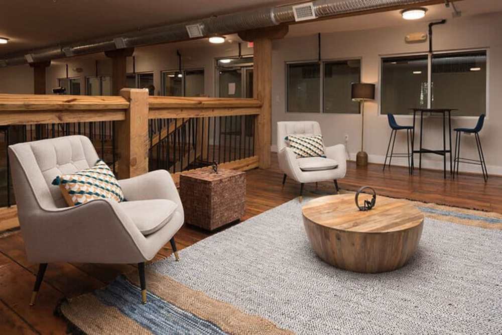 Clubhouse lounge in the upper level with cozy seating at High Street Lofts in Petersburg, Virginia