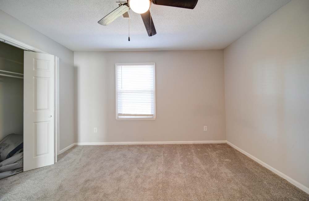 Bedroom with closet at Arlington Village Townhomes in Greenville, North Carolina